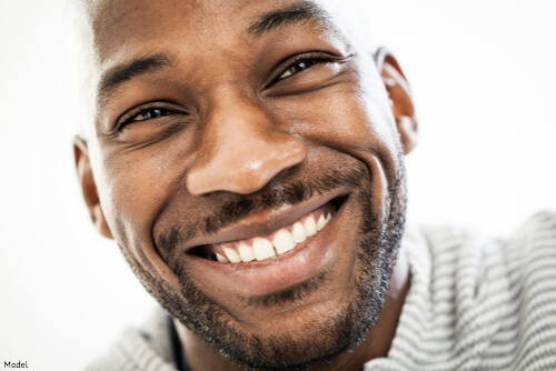 Man with bright white teeth thanks to teeth whitening